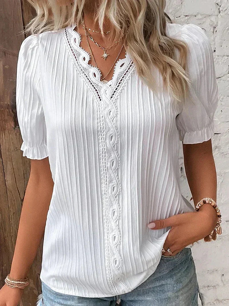 Almudena – blusa elegante con encaje y manga abullonada